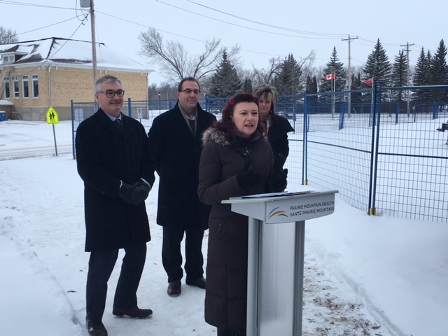 Health Minister Sharon Blady (Front) announces the new Ste Rose primary health care facility. Also shown is Dauphin MLA Stan Struthers (Left), MARFD Minister Ron Kostyshyn (Centre), and Prairie Mountain Health CEO Penny Gilson (Right)